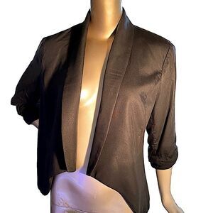 Black short tuxedo jacket. Med  shawl collar push-up sleeves , lined
